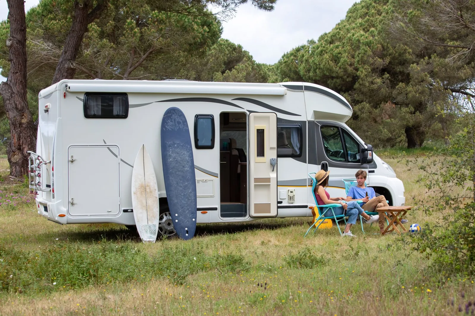 rv camping for beginners — motorhome set up at a scenic campsite