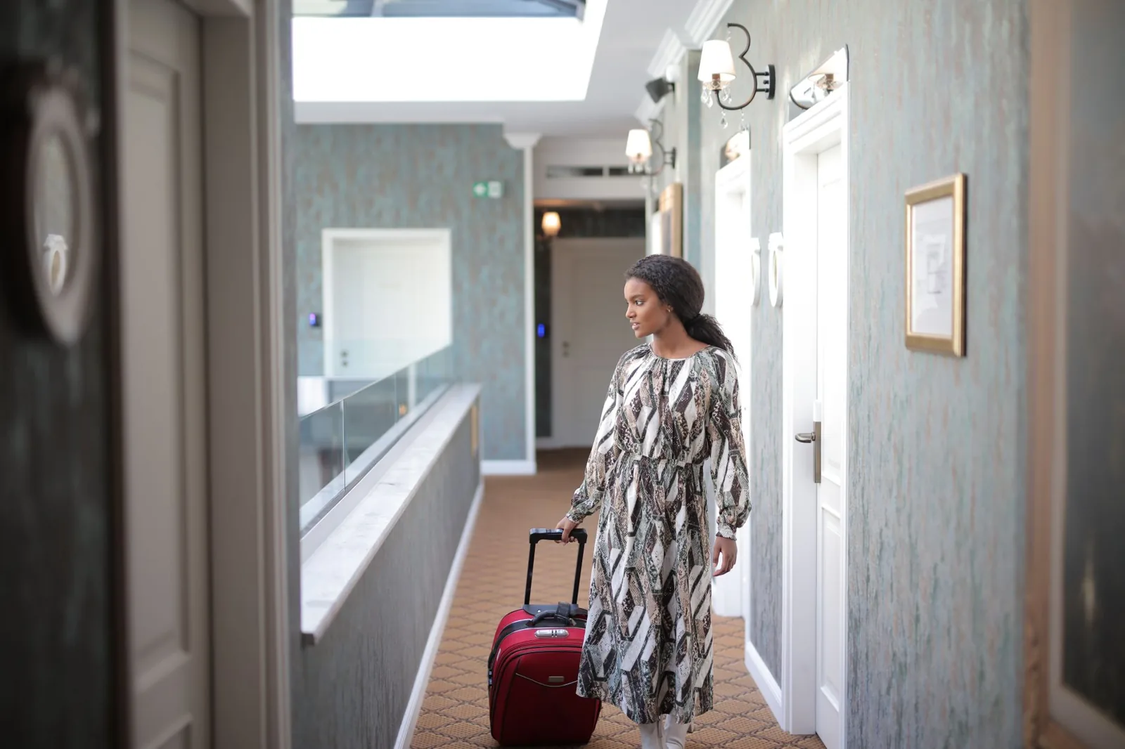 Two large checked suitcases on a luggage scale before a long international trip